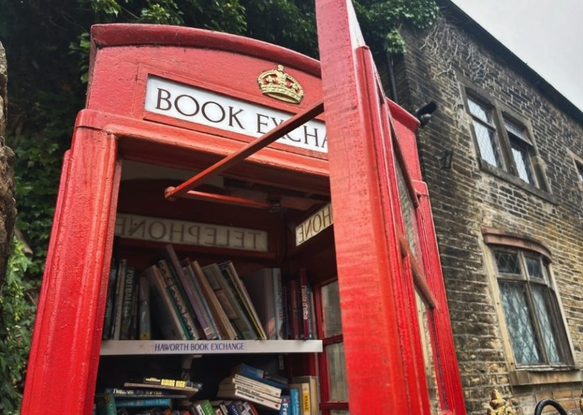 Book exchange inside a red telephone booth in Haworth.