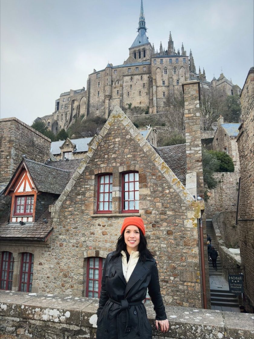 Person in front of Mont Saint-Michel