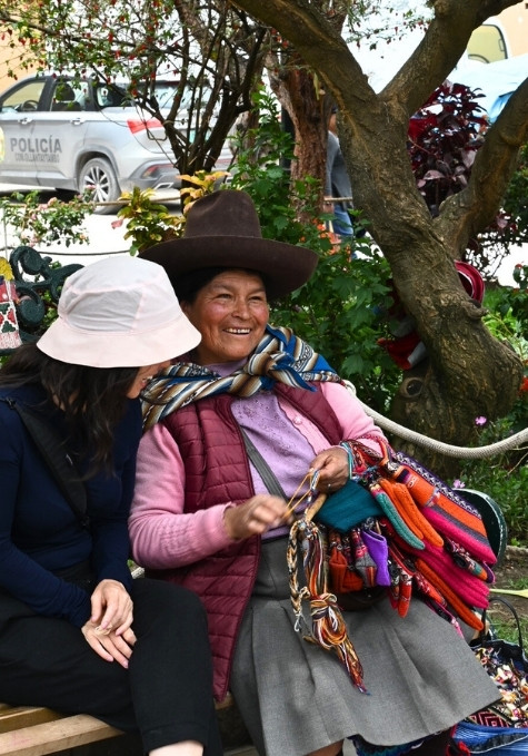Peruvian woman and tourist