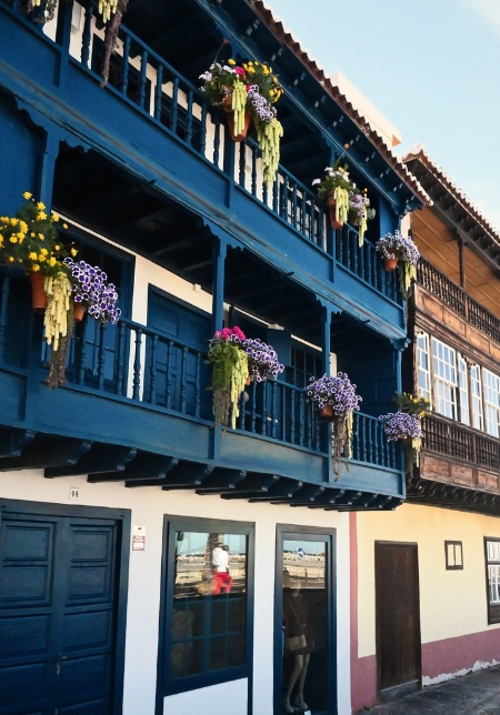 Traditional houses with wooden balconies - flower baskets