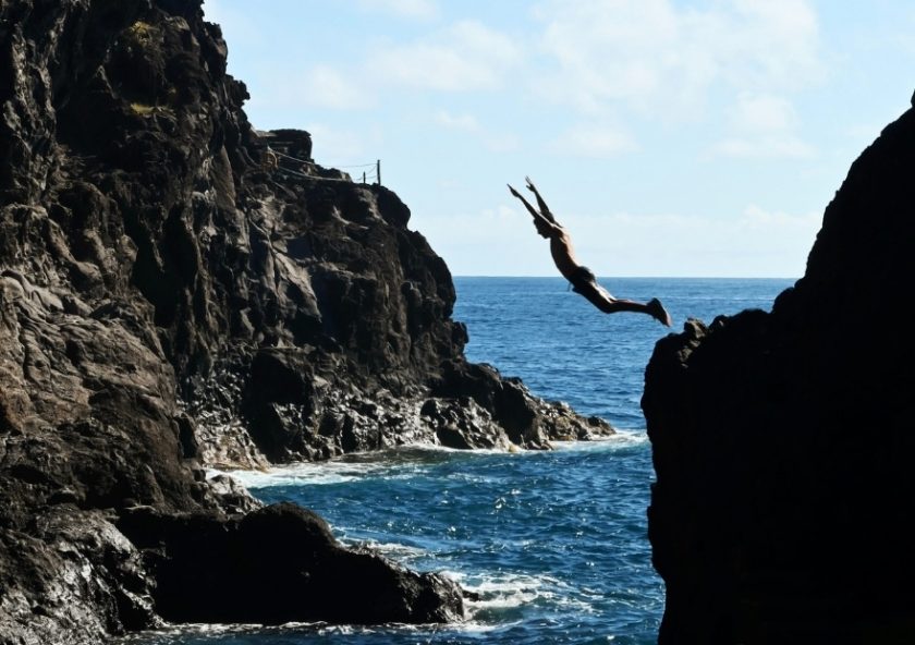 Man jumping into the sea in Poris de Candelaria