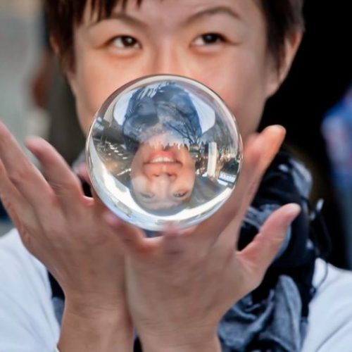Contact juggler with crystal ball, street performer in London